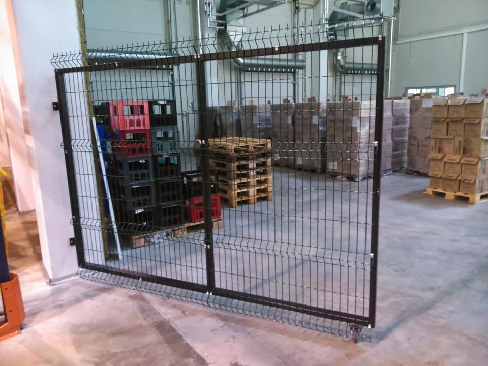 Steel mesh fence and gate in a warehouse